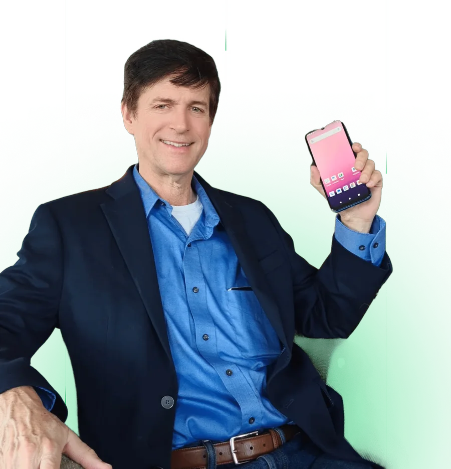 Brian Maw holding a phone